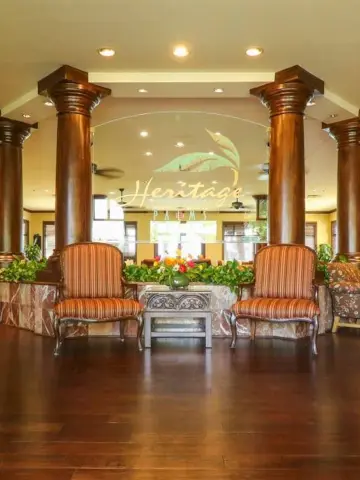 Front view of the Heritage Room. Two pilars with two chairs in the middle.